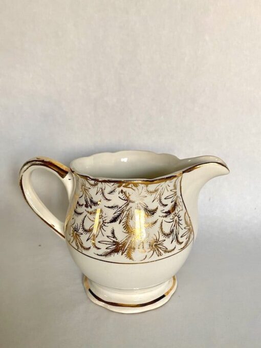 antique milk jug with gold design