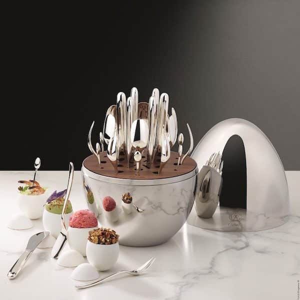 Christofle Mood silver flatware set displayed in its iconic egg-shaped case
