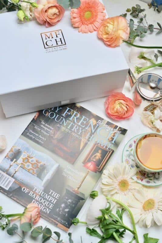 My French Country Home Box and magazine styled with tea, flowers, and elegant French tableware