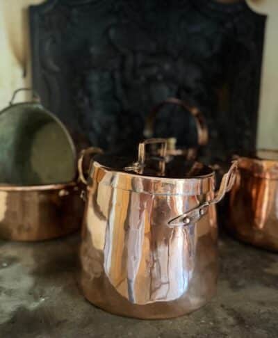 A French antique coper pot with original lid. A substantial and characterful display piece, sourced in the south of France.