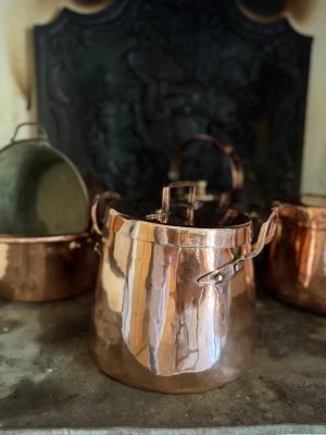 A French antique coper pot with original lid. A substantial and characterful display piece, sourced in the south of France.