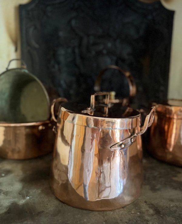 A French antique coper pot with original lid. A substantial and characterful display piece, sourced in the south of France.