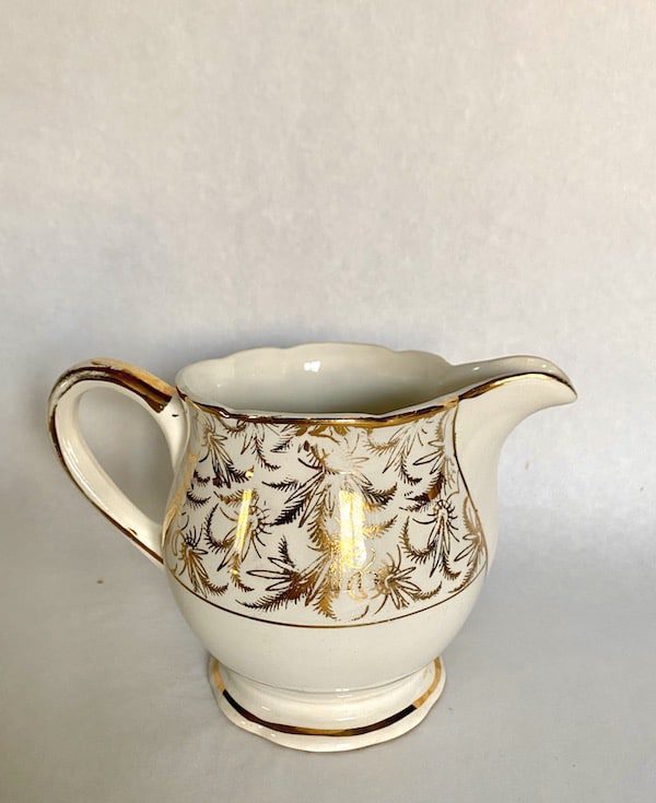 antique milk jug with gold design